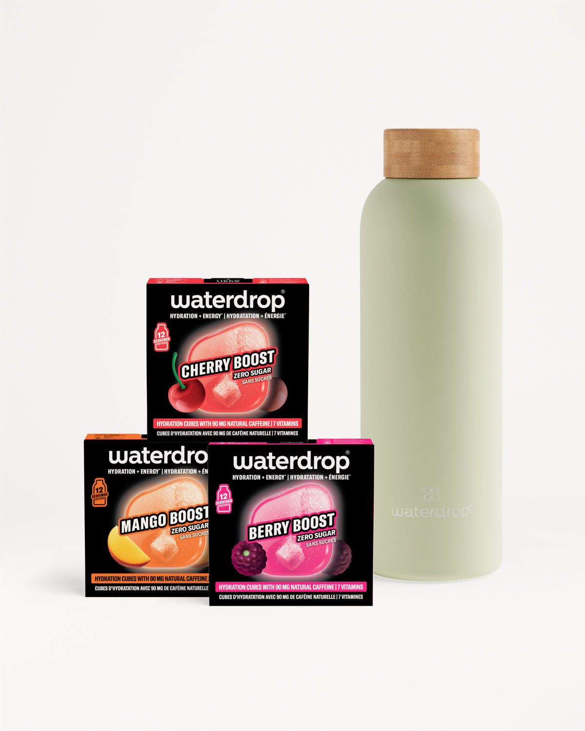 Trois boîtes Waterdrop Booster (Cherry, Mango, Berry) près d'une bouteille vert pâle avec bouchon en bois.