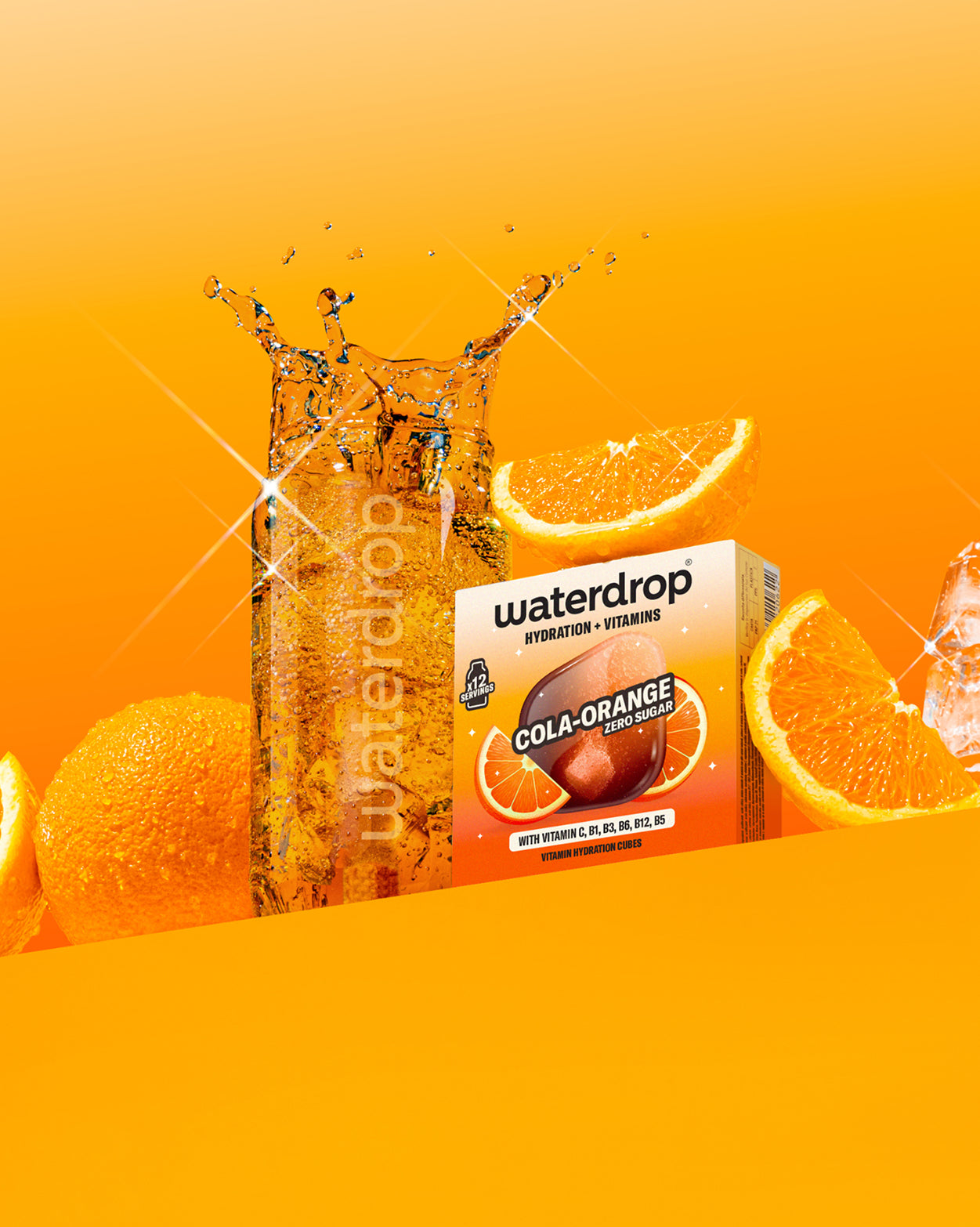 COLA ORANGE vitamin cubes dissolving in fizzy water.