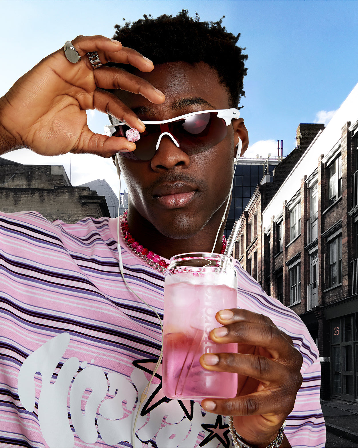 PINK LEMONADE microdrink close-up, person enjoying outdoors.