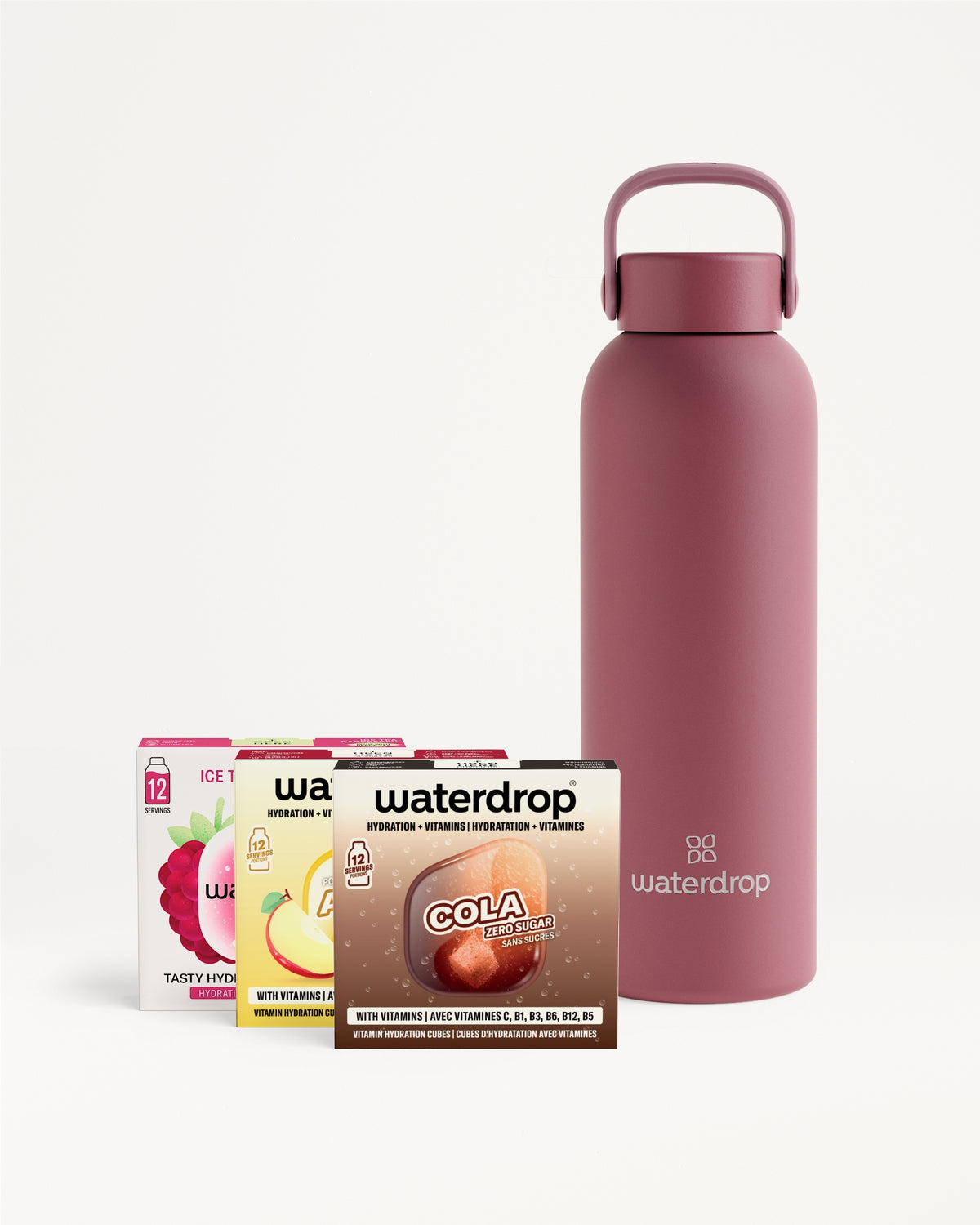 Bouteille en rose réutilisable avec poignée, accompagnée de sachets de mélanges pour boissons.