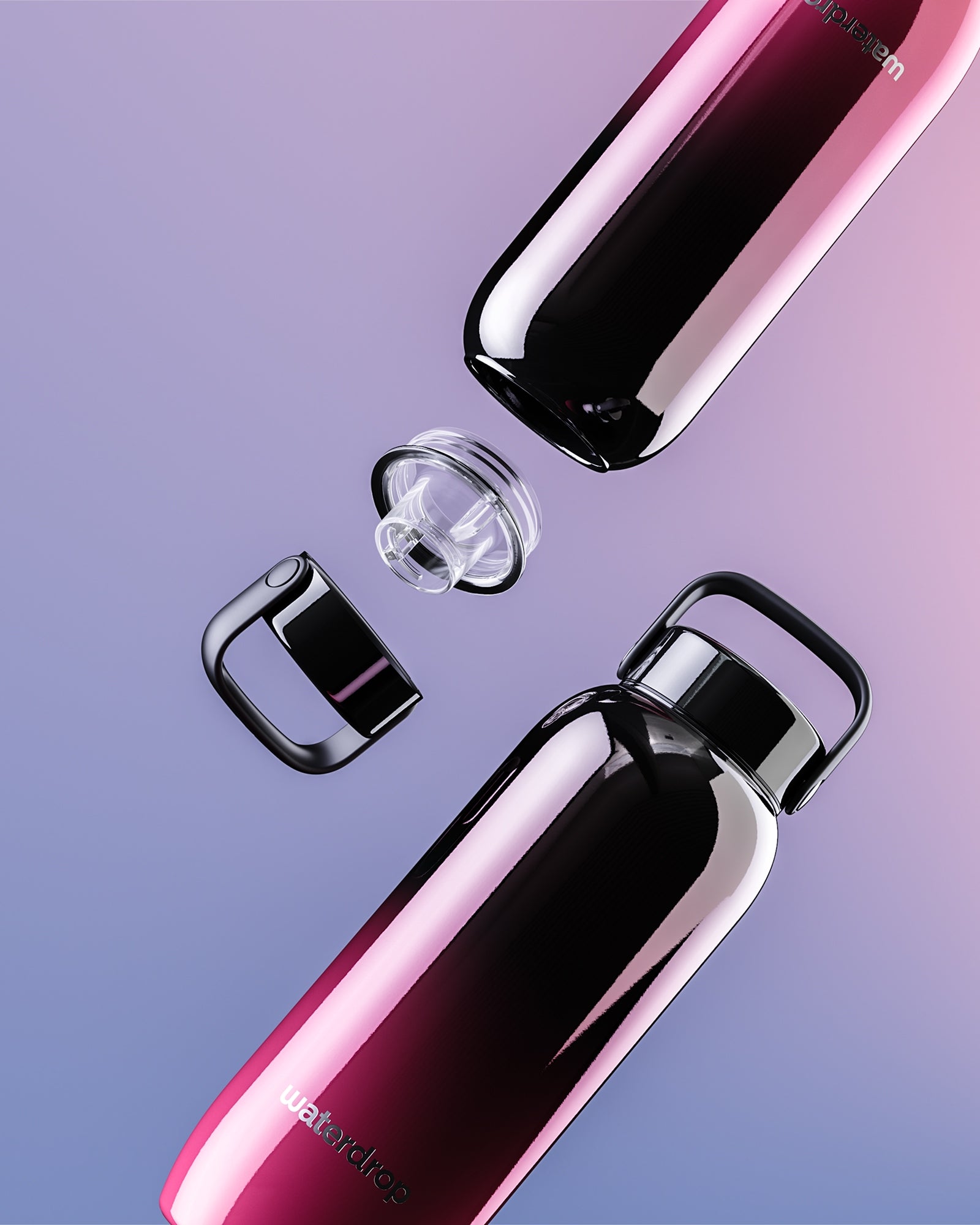Deux bouteilles en acier inoxydable avec dégradé rose et violet, bouchons retirés, disposées en diagonale.