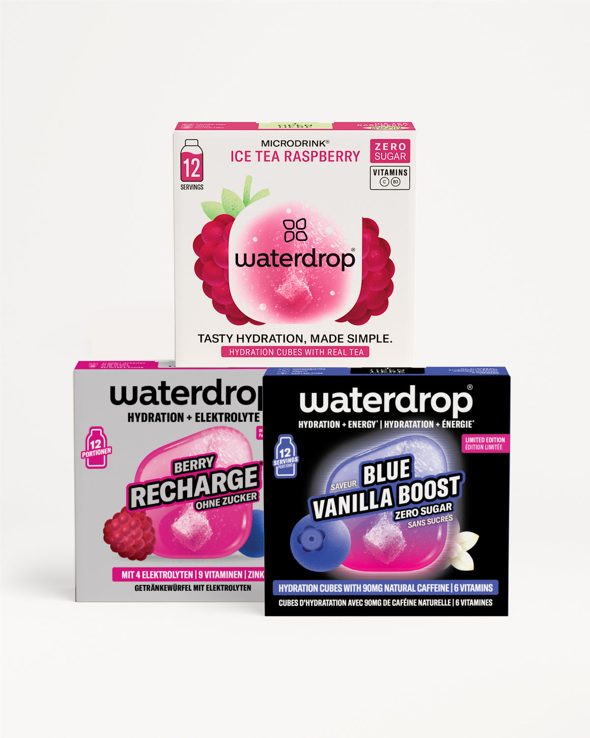 Trois boîtes Waterdrop d'hydratation empilées en pyramide, avec des designs d'emballage roses, violets et bleus.