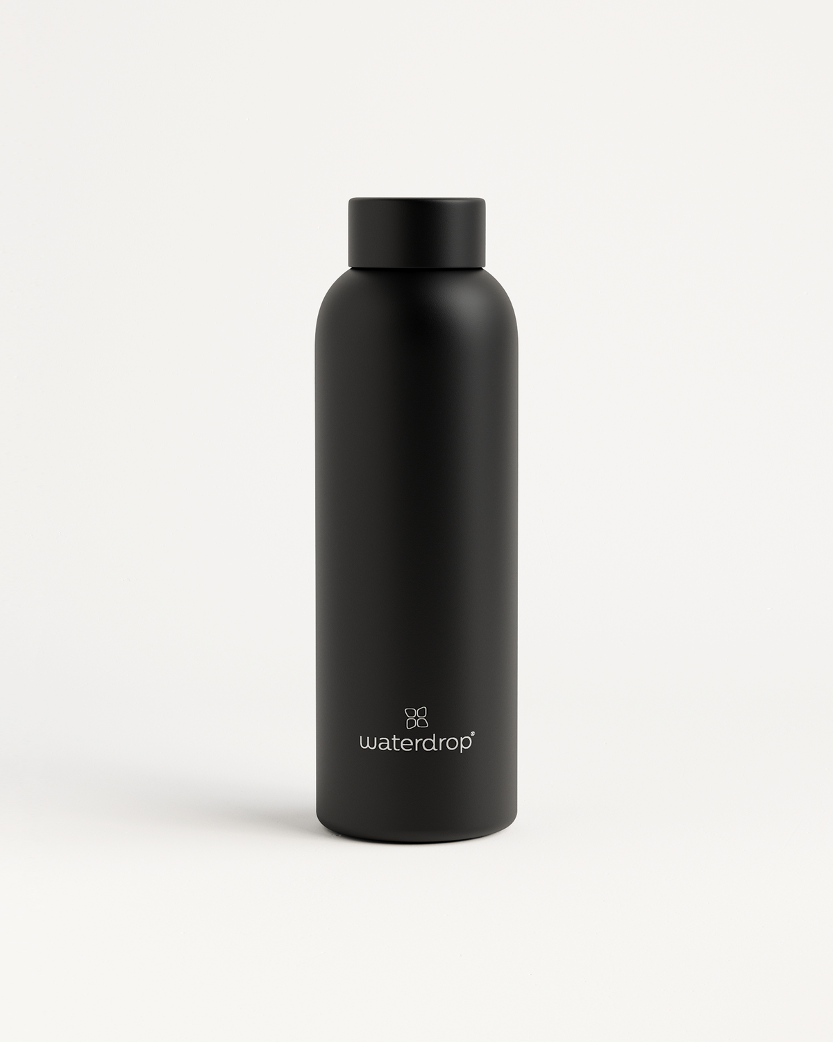 Bouteille Thermo Classique Inox, black bottle, logo visible.