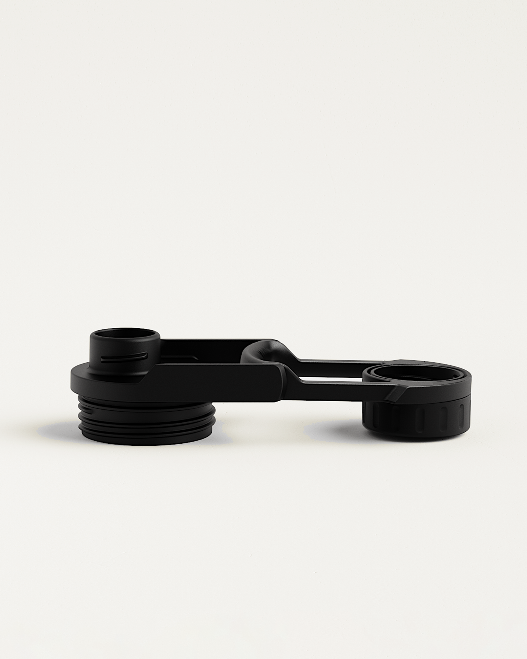 Couvercle à Bascule - close-up of a black bottle lid.